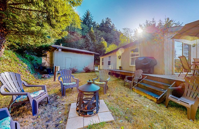 Lakefront home with water/dune access, deck, grill, firepit, dock, & W/D
