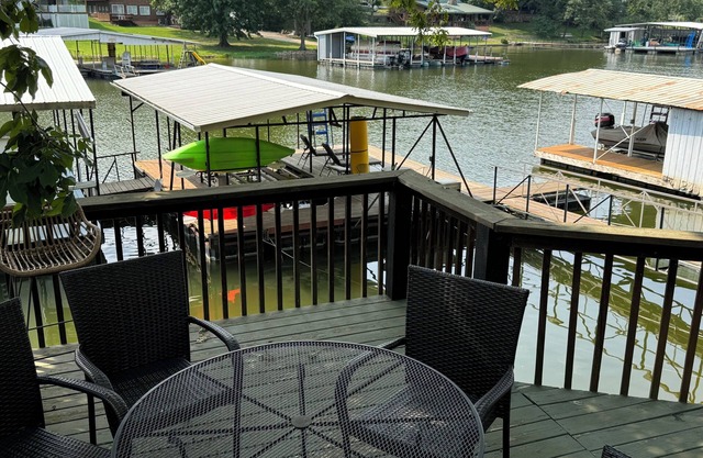 Lakefront house with large deck, private boat dock, and covered outdoor games!