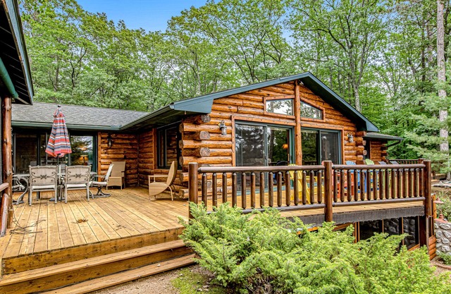 Lakefront log cabin on 3.5 acres with dock, gazebo & sunset views - dog-friendly