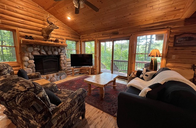 Lakefront Log Condo with large patio, fire pit, central AC, on the Chain!