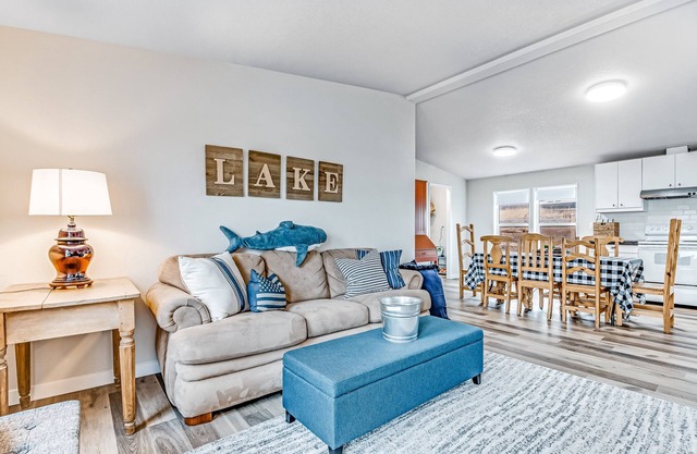 Lakefront retreat near town with spacious deck, free WiFi, beach access, & views