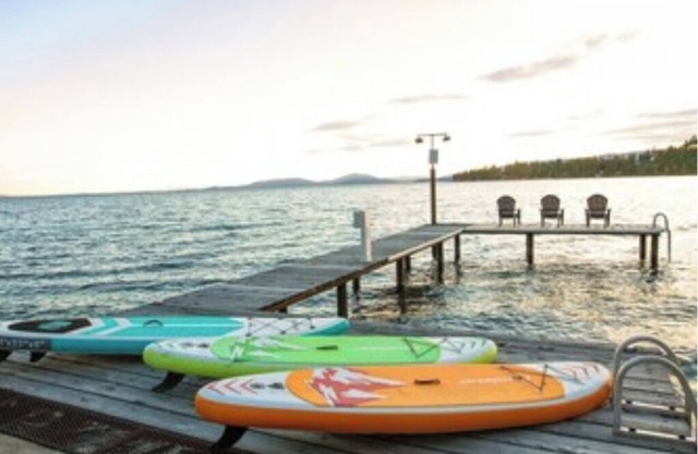Lakefront retreat w/private dock, SUPs & fast WiFi - walk to restaurants!