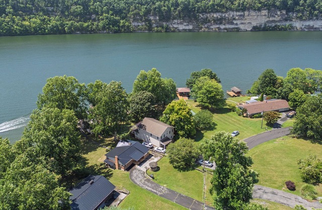 Lakefront retreat with private dock, open living, fire pit, full kitchen & cozy indoor spaces