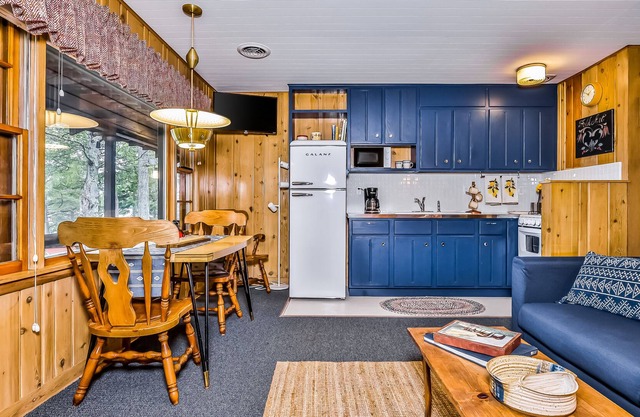 Lakefront suite at a vintage resort with communal dock, rowboats & firepit