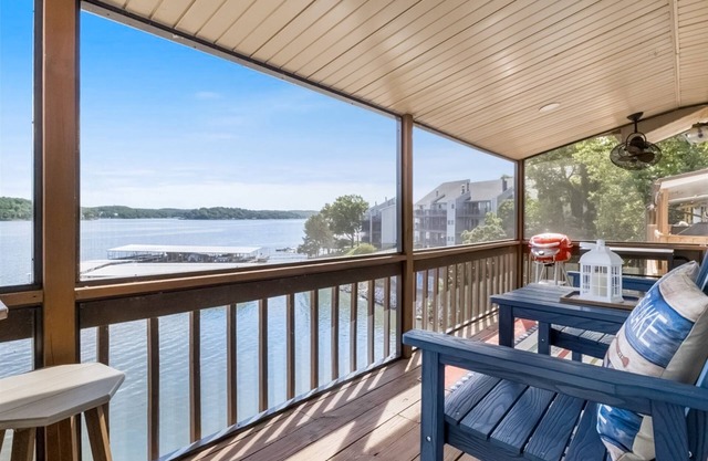 Lakefront top-floor condo with grill, screened-in balcony, pool, fireplace, W/D