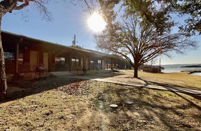 Lakefront views and covered porches among the trees.