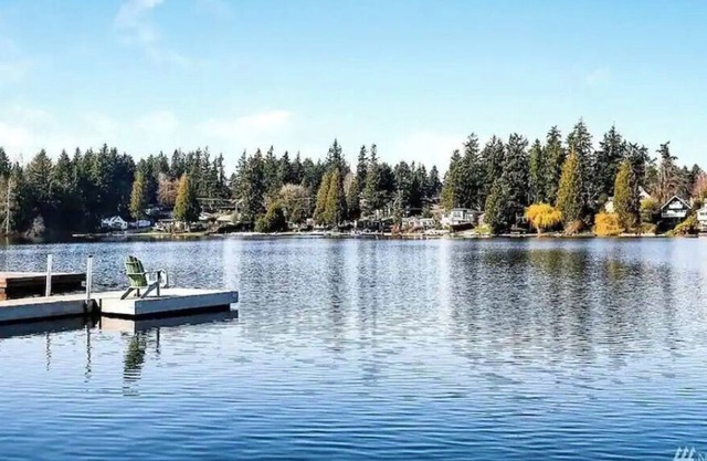 Lakefront with private dock, AC, and fully fenced.