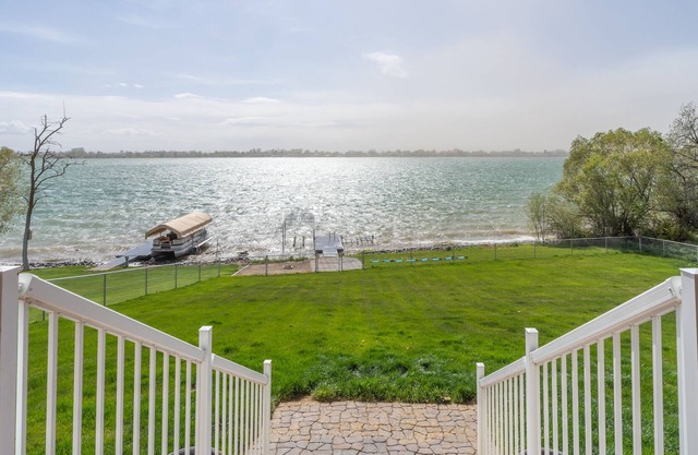 Lakeside home w/dock, gamerooms, fenced yard