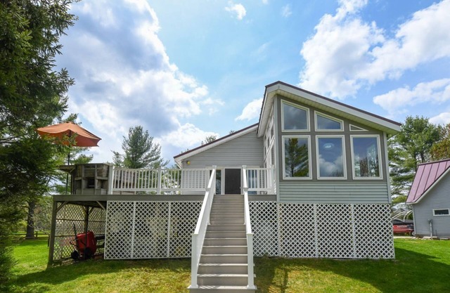 Lakeside Home with 450 feet of Private waterfront on Thompson Lake