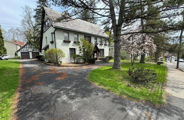 Large English Tudor offering 3 generous floors of living space - Belmont/Travers