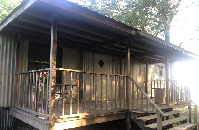 Large porches overlooking acres of lawn and pasture near lakes and rivers.