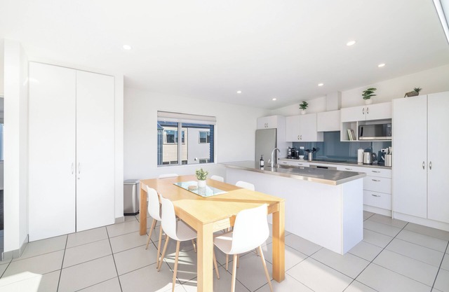 Large townhouse. Double garage plus additional parking. Full kitchen and dining.