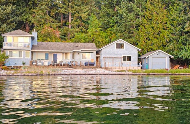 Large waterfront beach house with hot tub, game room, & private beach access