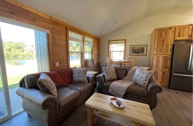 Legacy farm waterfront cottage in welcoming Eau Claire with WiFi, AC