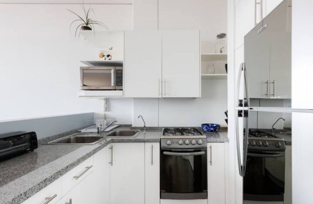 Loft in fifth floor with great views to green and the city and a roof garden too