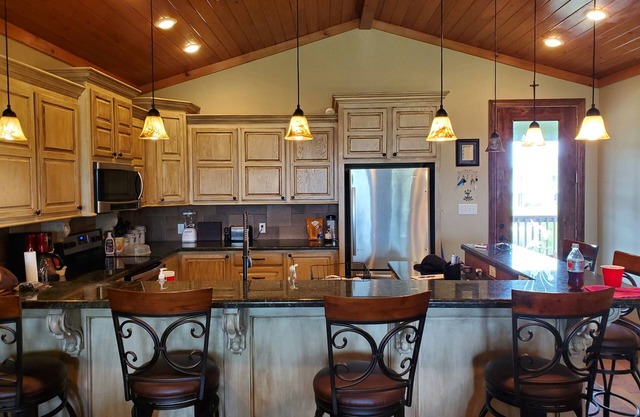 Lovely 4-bedroom elevated house with Front and Back Porches, on a canal