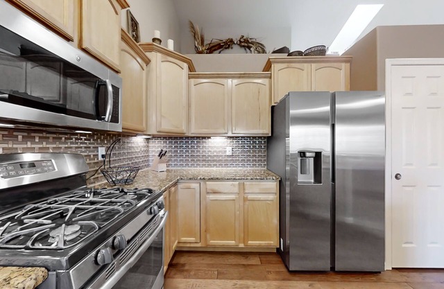 Lovely home with an enclosed yard, fireplace, pool table, games, W/D, & AC