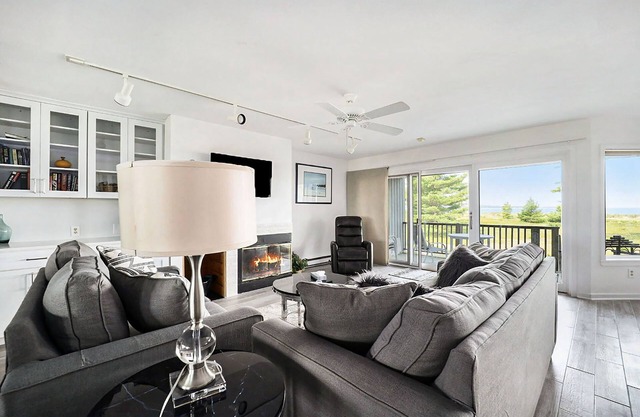 Lower-level beachfront condo with deck, lake views, washer/dryer, fireplace
