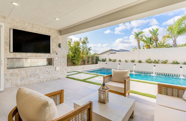 Luxe home near the beach with a pool, grill, office, gourmet kitchen, W/D, & AC