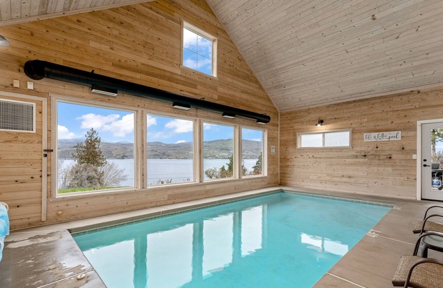 Luxe lake-view home with a private, indoor pool, patio, washer/dryer, & AC