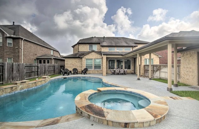 "Luxurious 3-Bedroom Mansion with Heavenly Heated Pool and Jacuzzi Retreat"