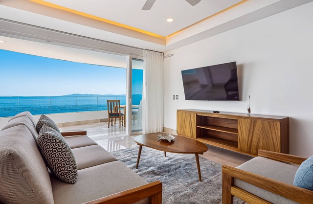 Luxurious 6th-floor condo with pool, oceanfront balcony & water view