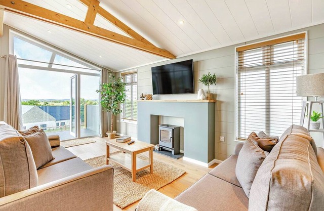New for 2022. Luxurious lodge with vaulted ceilings and a welcoming feature fireplace.
