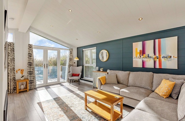 New for 2022. Luxurious lodge with vaulted ceilings and a welcoming feature fireplace.