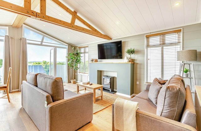 New for 2022. Luxurious lodge with vaulted ceilings and a welcoming feature fireplace.