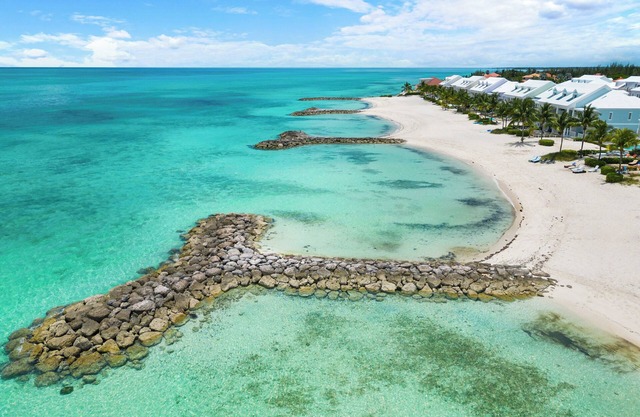 Luxury Beach side escape, steps from private beach, restaurant, marina, and café