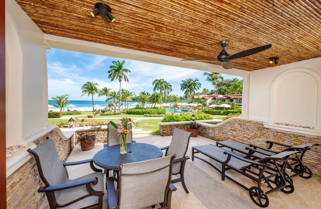 Luxury Beachfront Condo w/ High-End Wood Furnishings and Ocean Views in Exclusiv