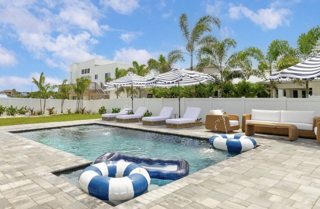 Drift Haus | Sleeps 12 – Modern 3-Story Cocoa Beach Villa with Heated Pool, Elevator & Rooftop Ocean Views