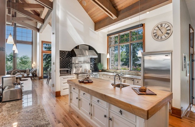 Luxury estate with grand outdoor space, hot tub, game room, & two kitchens