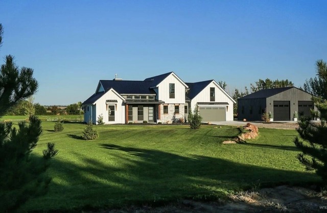 Luxury Farmhouse on 50 acres with a pond and private beach in the backyard. Wow