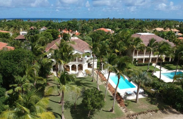 Luxury golf villa with private pool and service staff in exclusive resort near private beach