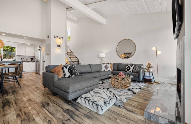 Luxury Malibu retreat with sweeping views, balconies, pool, and tennis court