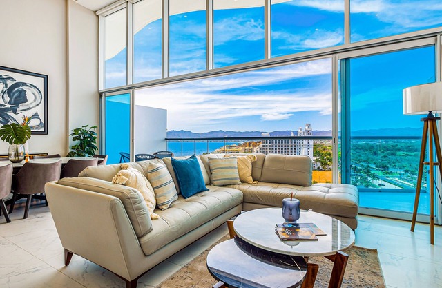 Luxury ocean-view condo with resort pool, private balcony, and washer/dryer