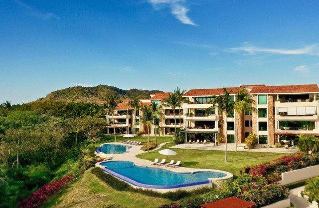 Luxus Ocean View Condo mit Golf Cart & Cook - Premier Mitgliedschaft inklusive!
