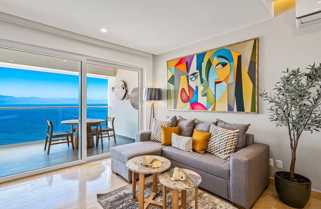 Luxury oceanfront apartment with private balcony, rooftop pool & gym access