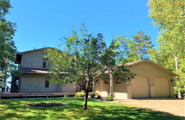 Magnificent 5 bedroom retreat home with beautiful sand beach on Whitefish Lake