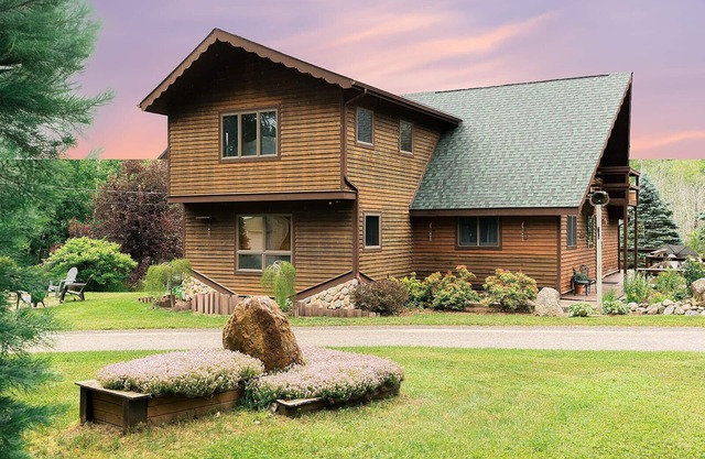Main cabin + sleeping bunkhouse, heated inground pool & u-shaped driveway.