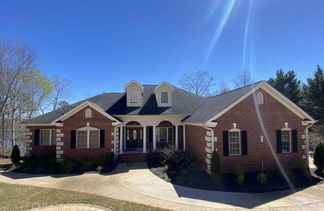 Majestic Lakefront Home with private dock, basketball court, firepit, and more..