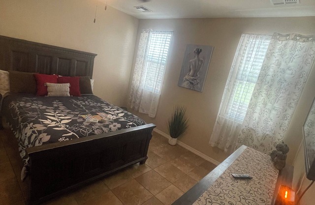 Master bedroom with its own full bathroom and walking closet + shared spaces.