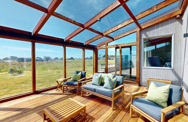 Meadow home with sunroom, ocean view, shared pools & tennis courts - dogs OK