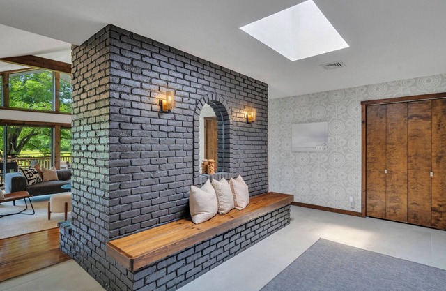 Mid-century home on seven serene acres of rolling meadows with private pool...