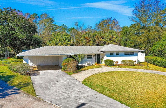 Mid-century modern lake house with dock & Florida room - quick drive to beach