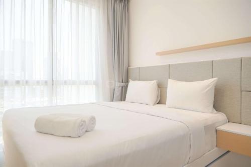 Minimalist and Comfy 1BR Ciputra World 2 Apartment By Travelio