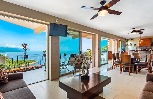 Mismaloya Beach condo with ocean views, on-site pool, grill, & private balcony