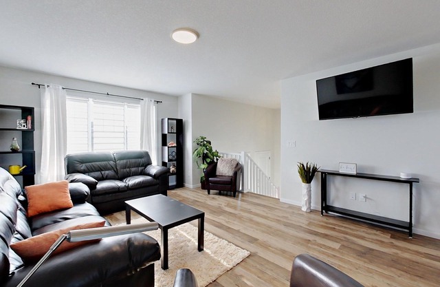 Modern 4 Bedroom House for 8 Guests in Red Deer ~ Games Room, Fire Pit, A/C, BBQ