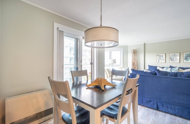 Modern beachfront condo with balconies overlooking beach and ocean in O.O.B.